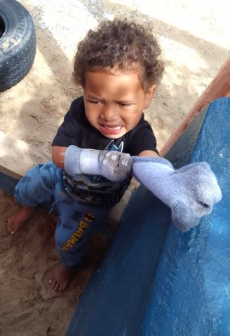 PK Harrison wrestles with his socks